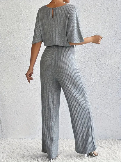 Comfortabele jumpsuit met V-hals en strikceintuur | Else