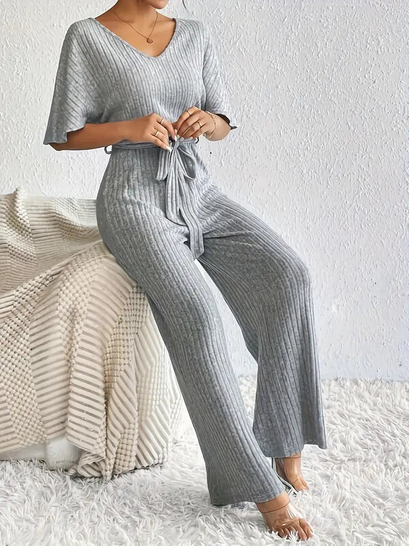 Comfortabele jumpsuit met V-hals en strikceintuur | Else